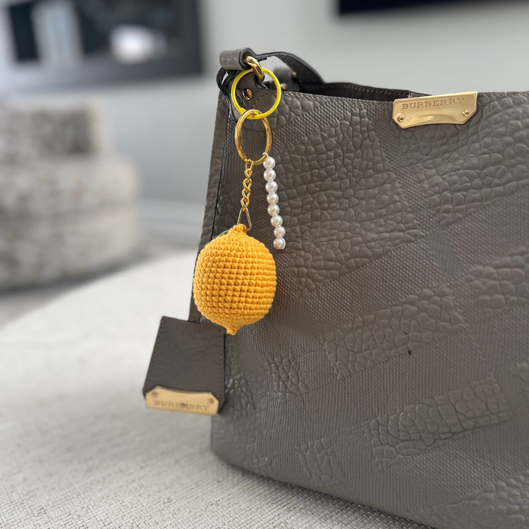 Yellow lemon-shaped keychain with beads