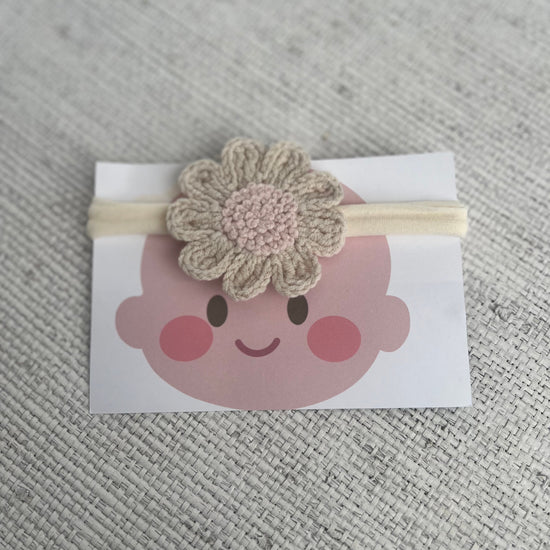 Headband with a crocheted flower 